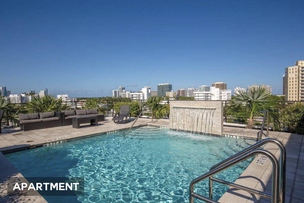 View of the pool and sun-drenched terrace at Bay Harbor, a modern residence offering relaxation and luxury in North Miami Beach