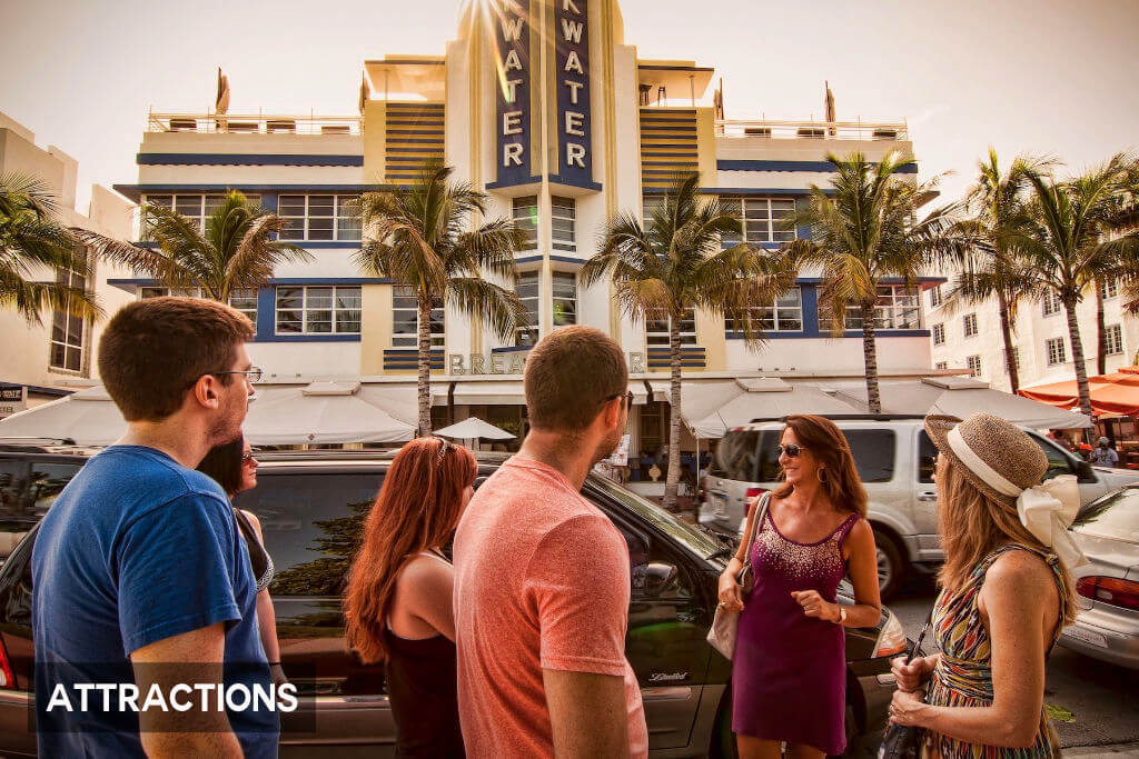 A guide leading tourists to iconic Art Deco architectural sites during the walking tour in Miami Beach