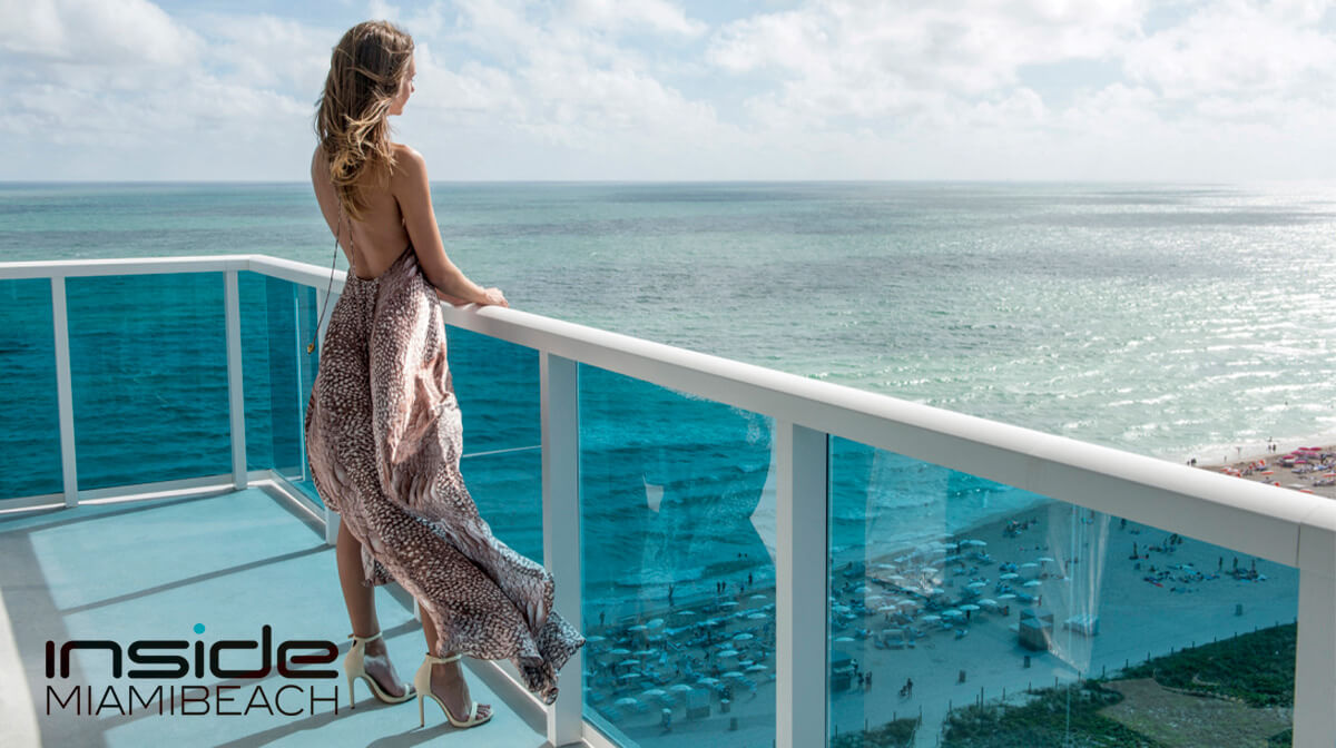 Panoramic view from 1 Hotel South Beach suite balcony, highlighting crystal-clear waters and sandy beach, perfect for luxury and relaxation